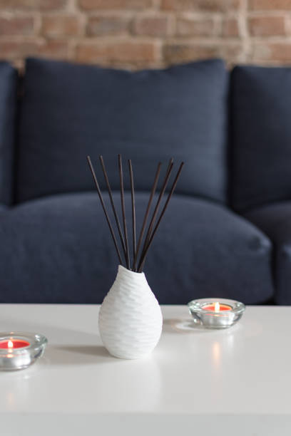istock Room air refreshers and candles on table on home interior background. 1179811786