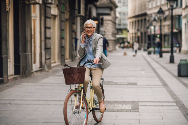 istock Woman commuting to work with a bicycle 1179811978