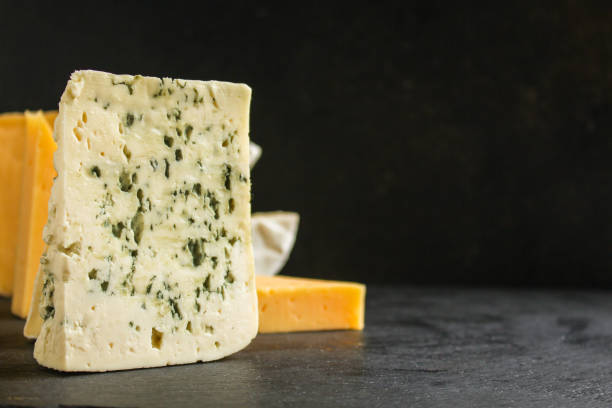 istock cheese variety (delicious snack, different types of hard and soft cheese) menu concept. food background. copy space. Top view 1179812608
