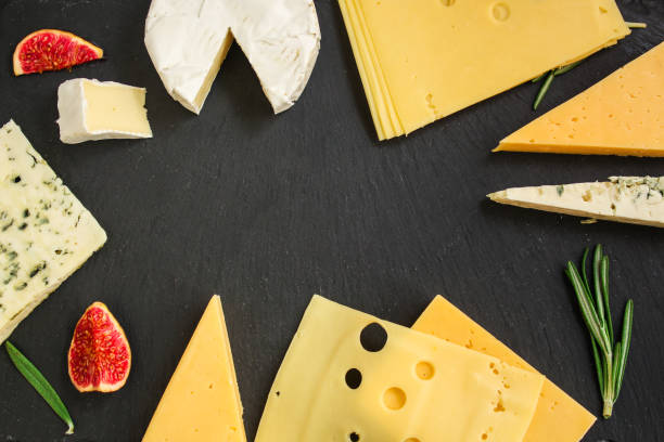 istock cheese variety (delicious snack, different types of hard and soft cheese) menu concept. food background. copy space. Top view 1179812645