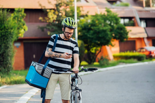 istock Delivery guy standing in the street 1179813102