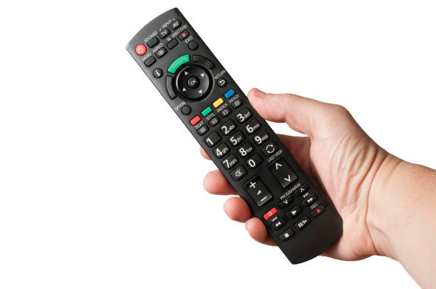 istock Hand hold a TV remote control on white background 1179813246