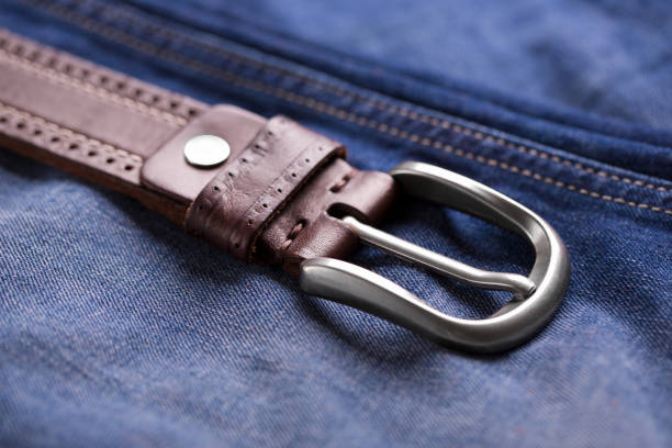 istock Leather belt close-up. Belt and blue jeans. 1179814650