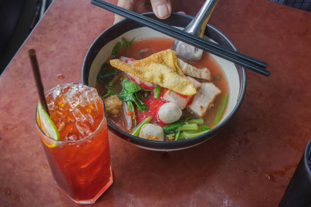 istock Yentafo is Pink soup noodle with Lemon Iced Tea. 1179816400