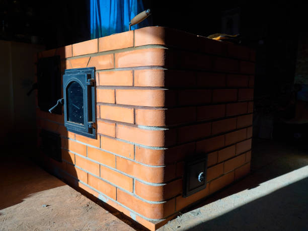istock Phased construction of a red ceramic brick stove. 1179817514