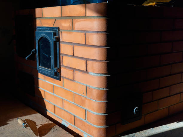 istock Phased construction of a red ceramic brick stove. 1179817548