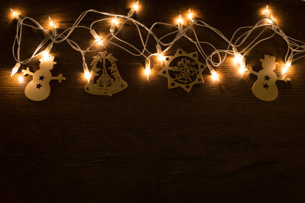 istock Christmas magic lights on a wooden background 1179817739