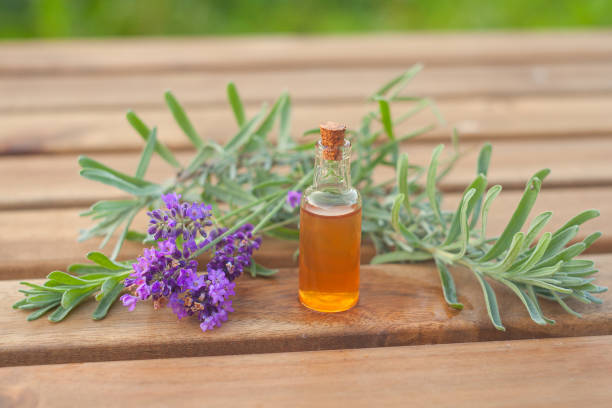 lavender essential oil in a beautiful bottle on the table
