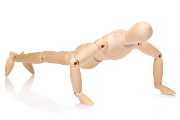 istock Small wooden dummy during push ups 1179823228
