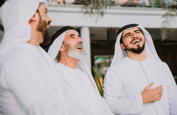 istock Three business men walking in Dubai wearing traditional emirati clothes 1179823716
