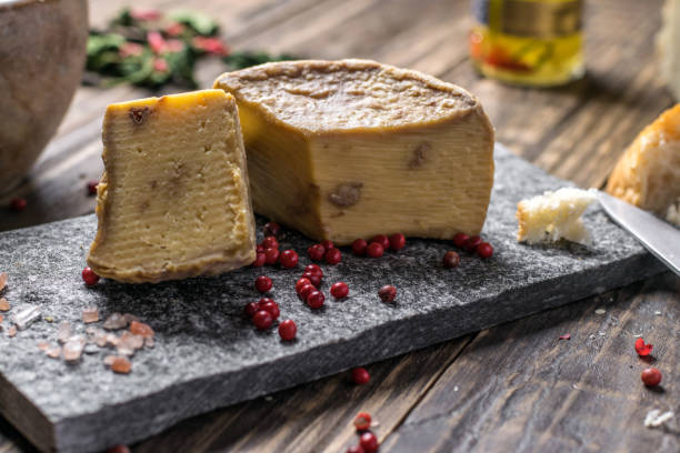 istock Artesian Cheese and a homemade souer dough bread on wooden background. 1179828042