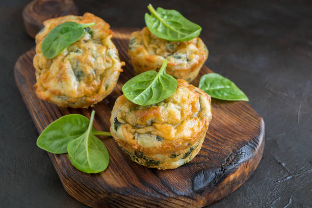 istock homemade cheese muffins with spinach. on dark background. 1179828201