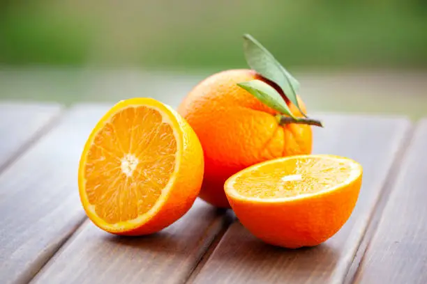 Photo of Oranges on wood background