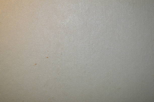 Black textured surface of plastic panel close-up