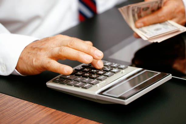 istock Senior business man counting money. 1179829826