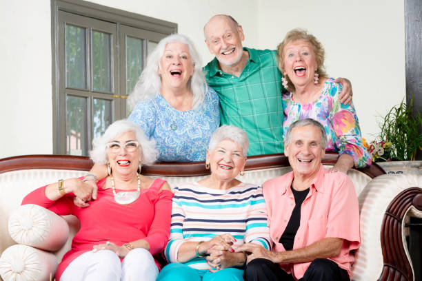istock Six Cheerful Senior Friends Laughing 1179831037