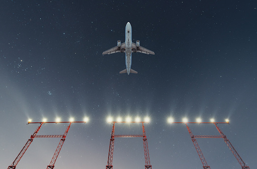 Passenger takes off at night.  Composite image.