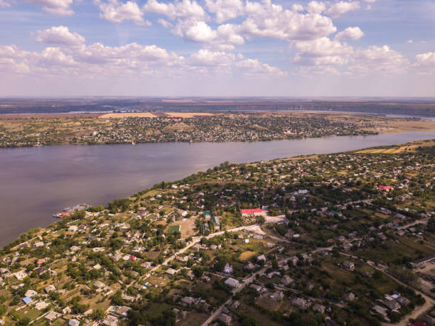 istock Arial view over the river and small village in autumn. 1179837442