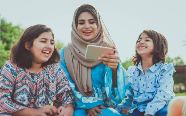 istock Mom and daughters spending time together at the park, in Dubai 1179837537