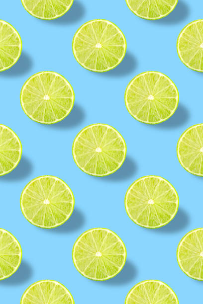 istock Vivid fruit pattern of fresh lime on colourful background 1179839055