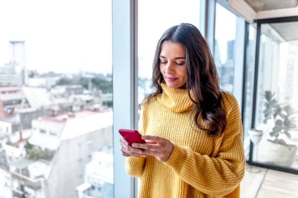 istock Young woman using her smartphone 1179839262