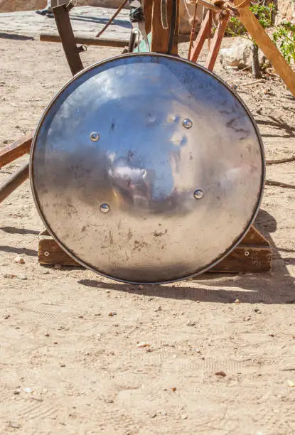 Rounded shield used by moorish armies during Reconquista period, 11-13th Century. Displayed on stand outdoors