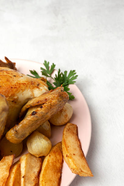 istock Appetizing roast chicken with garlic potatoes and onions 1179840764