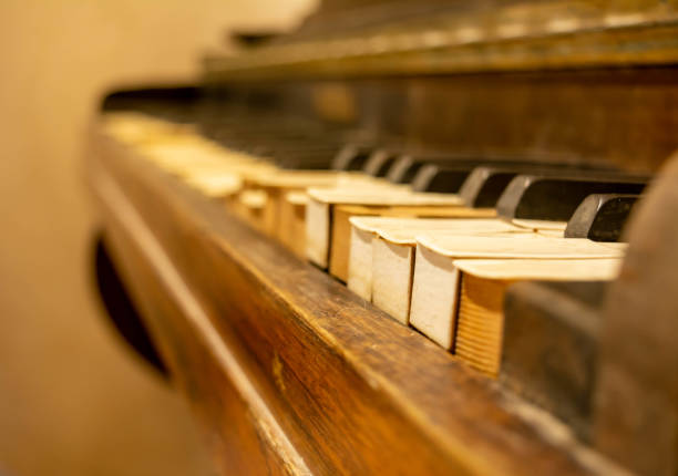 istock Close Up on Broken Old Piano Keys 1179844634