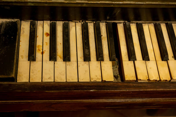 istock Close Up on Broken Old Piano Keys 1179844729