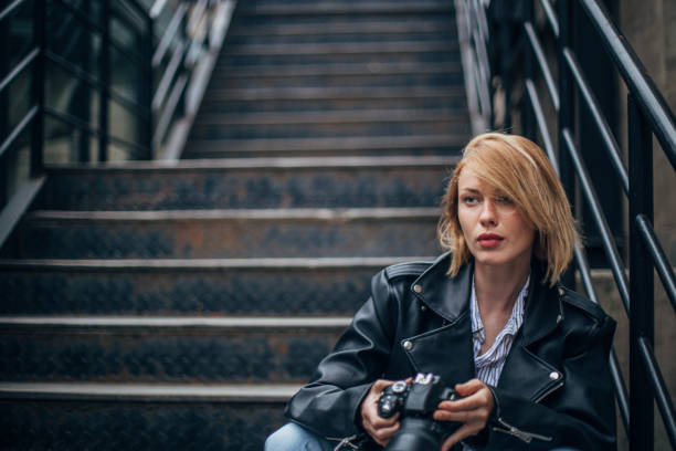 istock Young woman with photo camera 1179844838