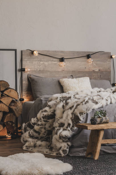 istock Copy space on empty grey wall of warm bedroom with winter design 1179846492