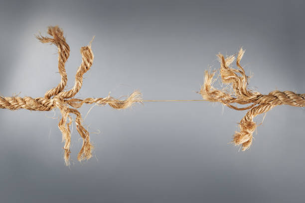 istock Rope near to break on gray background 1179847438