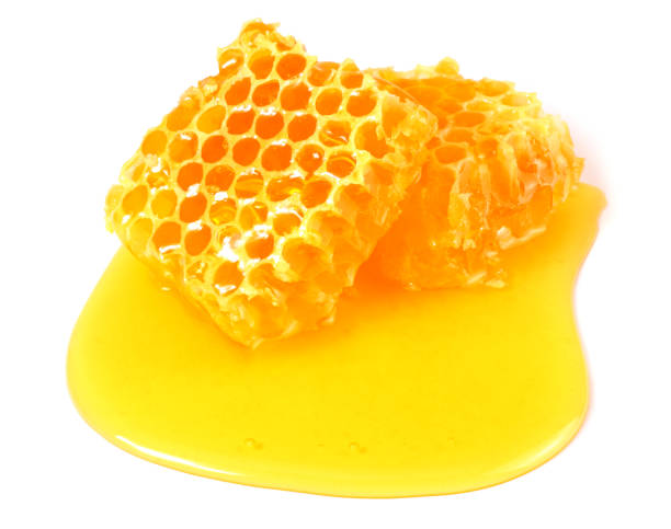 istock Honeycomb with honey isolated on white background 1179848909