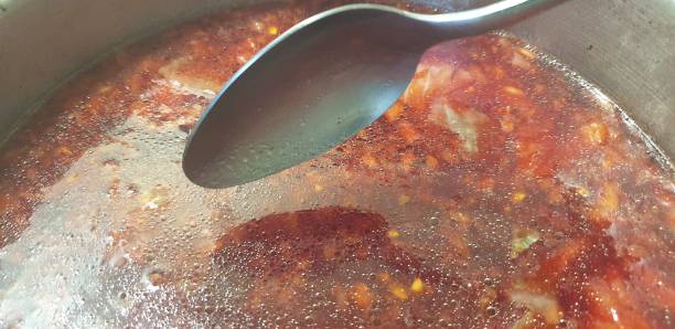 istock Borsch is cooked in a pan. Cooking fresh borsch. 1179851092