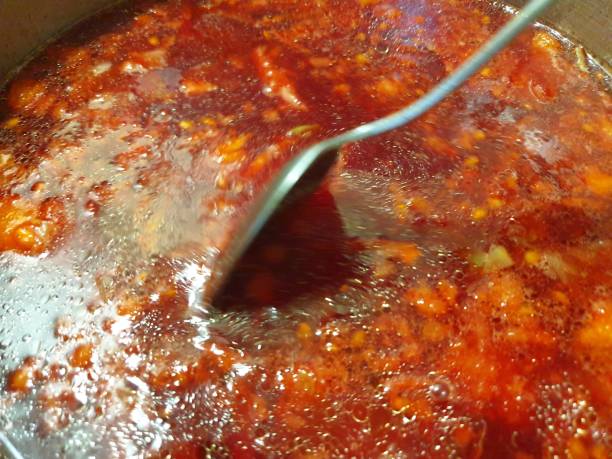 istock Borsch is cooked in a pan. Cooking fresh borsch. 1179851100