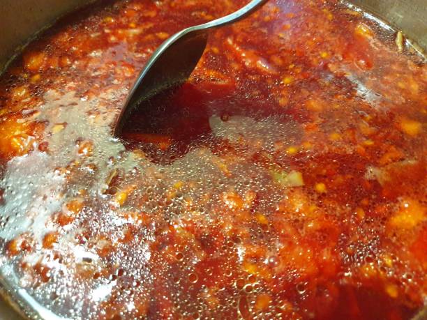 istock Borsch is cooked in a pan. Cooking fresh borsch. 1179851110