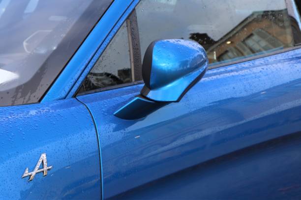 Vehicle interior with rear view mirror and windshield. Car detail.