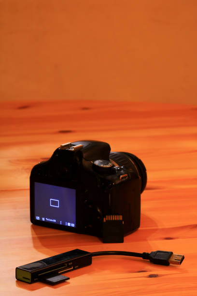istock Modern photographic equipment on wooden surface. 1179853992