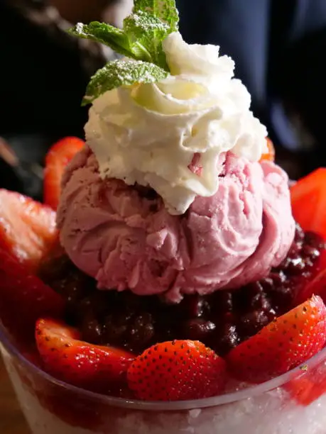 Korean shaved ice dessert with sweet toppings, Strawberry,Red bean Bingsoo or Bingsu