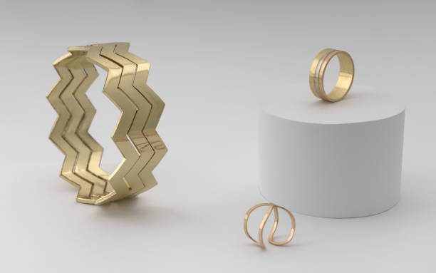 istock Zigzag shape modern golden bracelet with two rings on white 1179856811