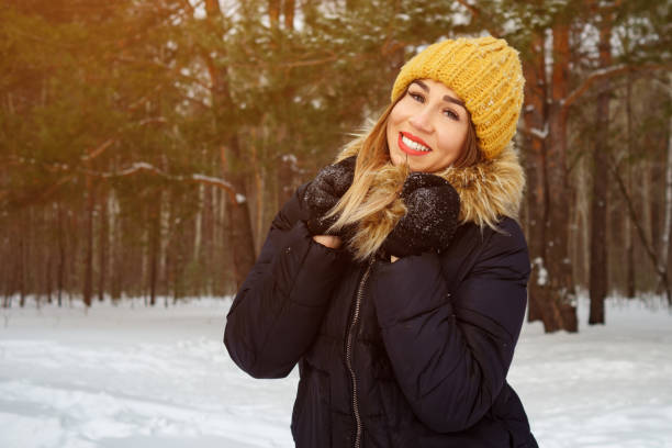 istock Happy smiling woman in winter forest. 1179857989