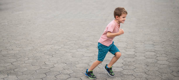 istock Beautiful boy running in the city 1179866026