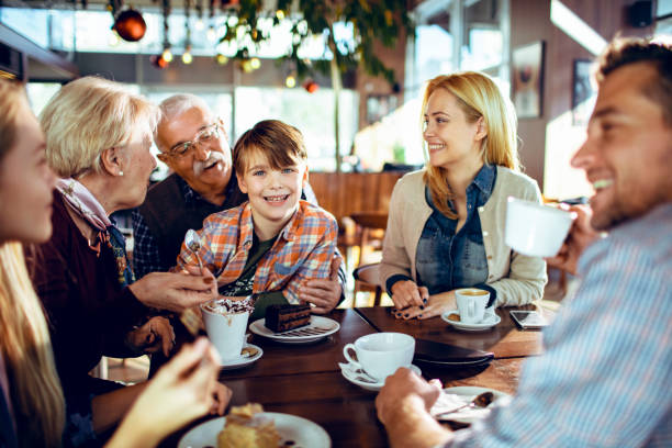 Close up of a multi generational family spending time during the holidays together in a cafe
