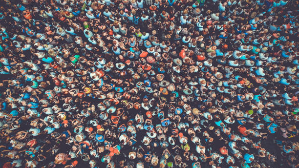 People crowd texture background. Bird eye view. Toned. People crowd texture background. Bird eye view. Toned. chaos photos stock pictures, royalty-free photos & images