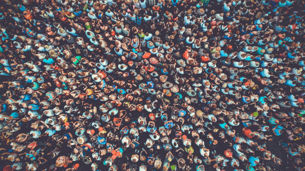 People crowd texture background. Bird eye view. Toned. People crowd texture background. Bird eye view. Toned. crowd stock pictures, royalty-free photos & images