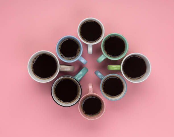 istock Coffee in the different cups on the pink background. Flatlay, cheerful day concept 1179871117