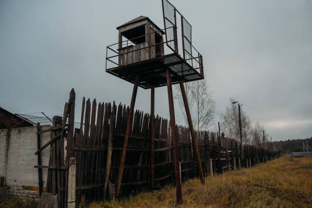 Old observation tower in abandoned Soviet Russian prison complex Old observation tower in abandoned Soviet Russian prison complex. rusty barb stock pictures, royalty-free photos & images