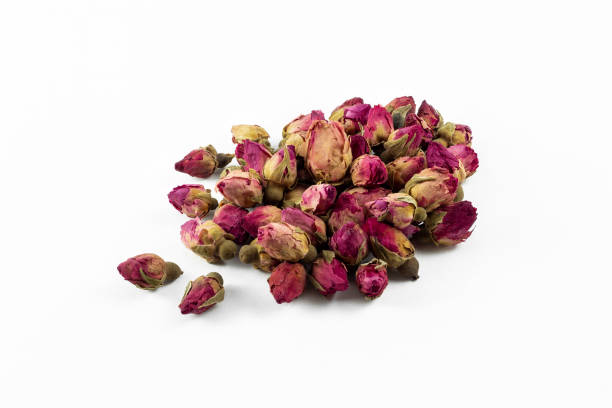 istock red and pink rose buds tea on white background 1179877186