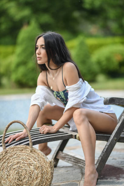 istock Female Relaxing Outdoors On Beach Chair 1179878137