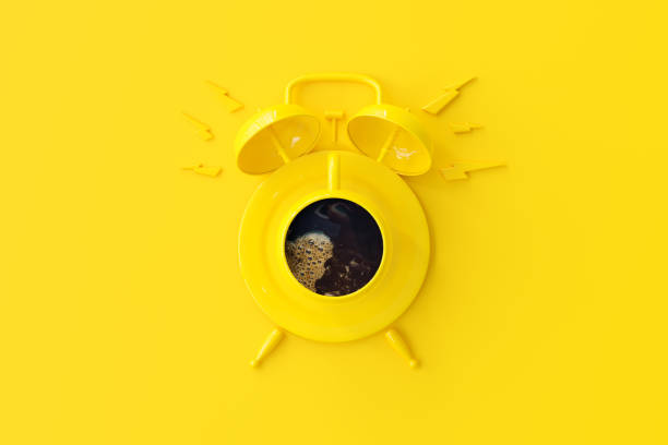 Yellow coffee cup looks like an alarm clock. minimal idea concept, 3d Render.